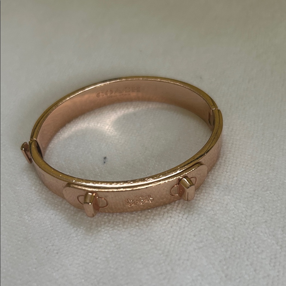 Coach Rose Gold Tone Studded Hinged Bangle Bracelet